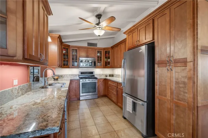 There is a large pantry cabinet with pull out shelving.
