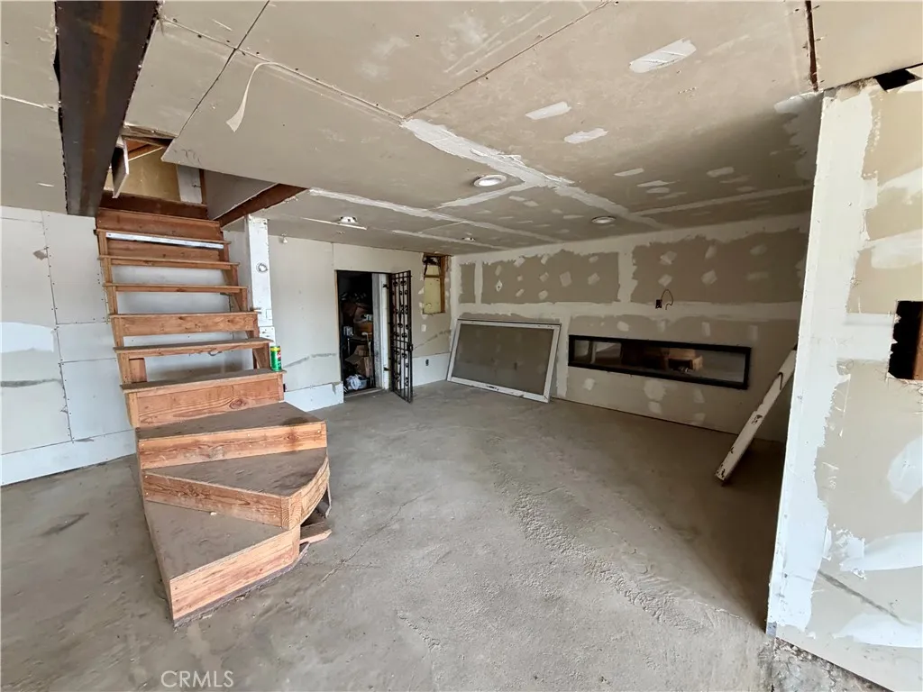 Bottom Level, unfinished, has electric fireplace for ambience. Bottom Level, unfinished, has electric fireplace for ambience.