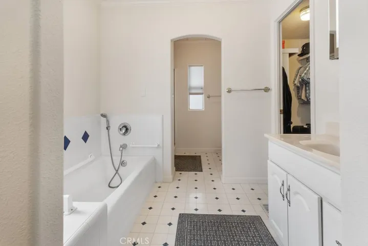 Master bathroom with tub and separate shower.