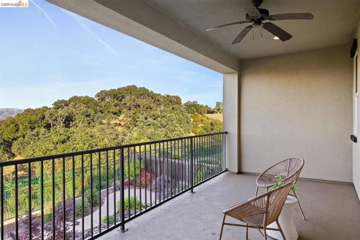 Balcony featuring a ceiling fan