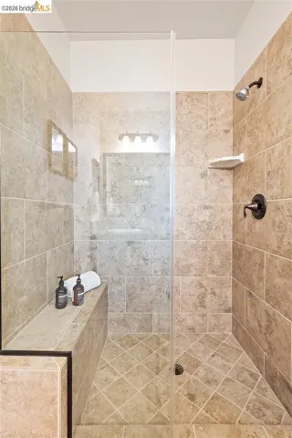 Full bathroom with a tile shower