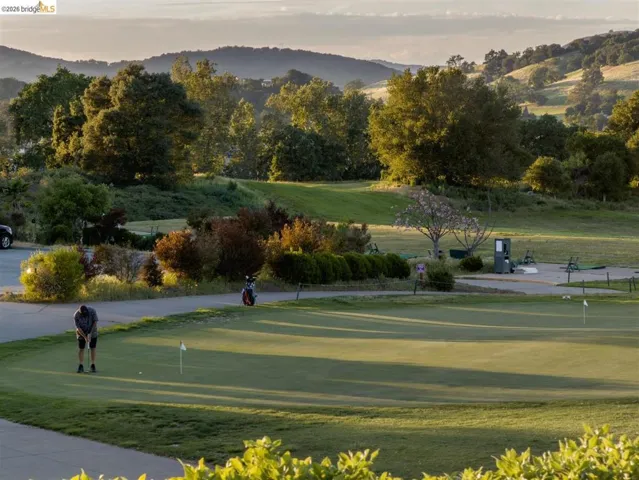 View of community featuring a mountain view and view of golf course