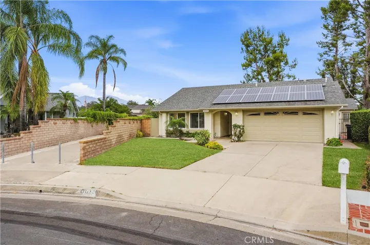 Front of the house with digitially altered lawn.