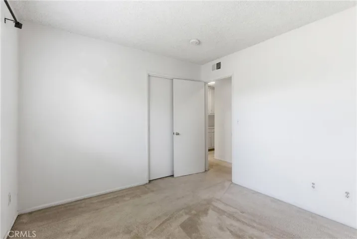 BEDROOM 2 WITH DOUBLE DOOR CLOSET