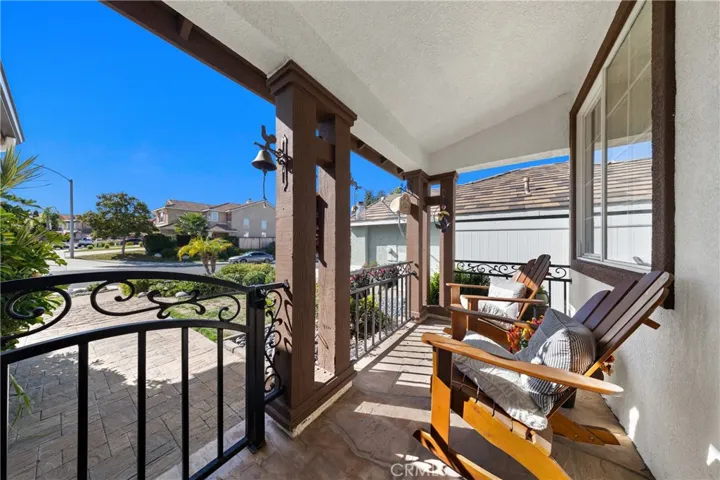 Private Veranda Porch Offering Peaceful Views And Outdoor Relaxation Space