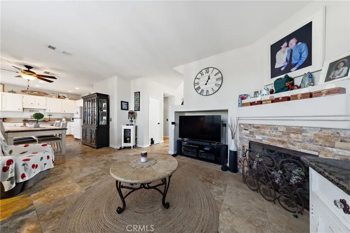 Inviting Family Room With Gas Fireplace And Open Flow To Kitchen