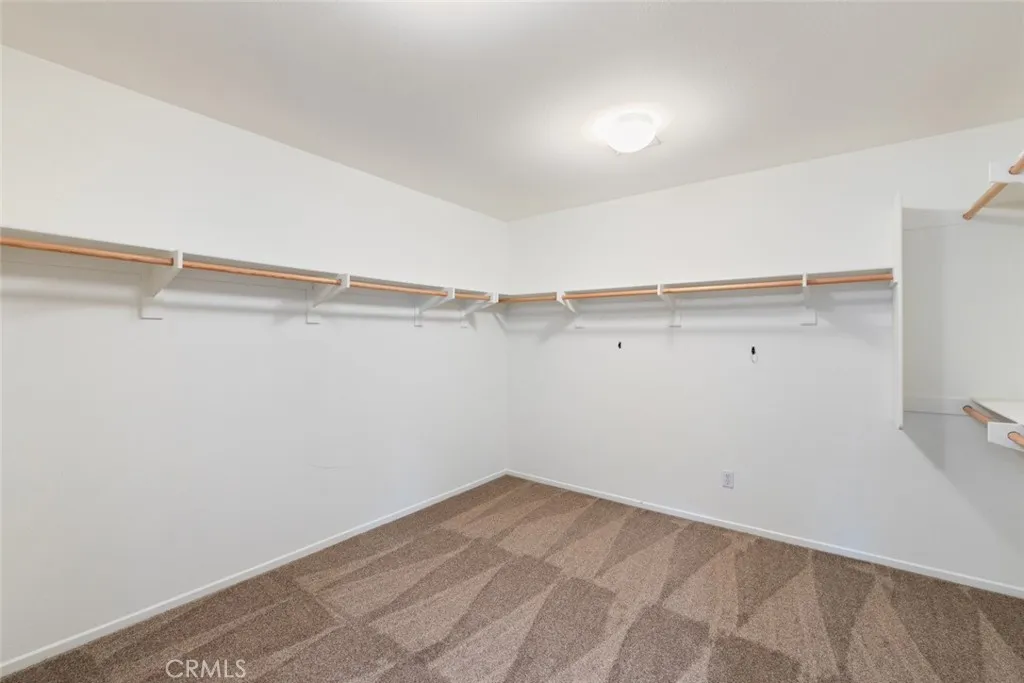 Upstairs Primary Walk-In Closet.