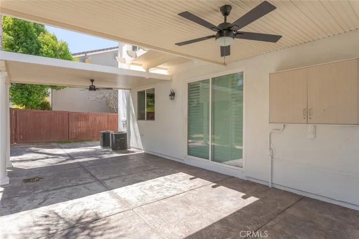 Covered patio w/ceiling fans.