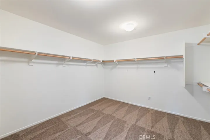 Upstairs Primary Walk-In Closet.