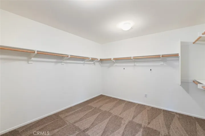 Upstairs Primary Walk-In Closet.