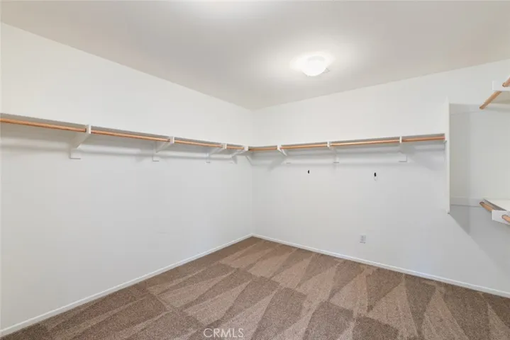 Upstairs Primary Walk-In Closet.