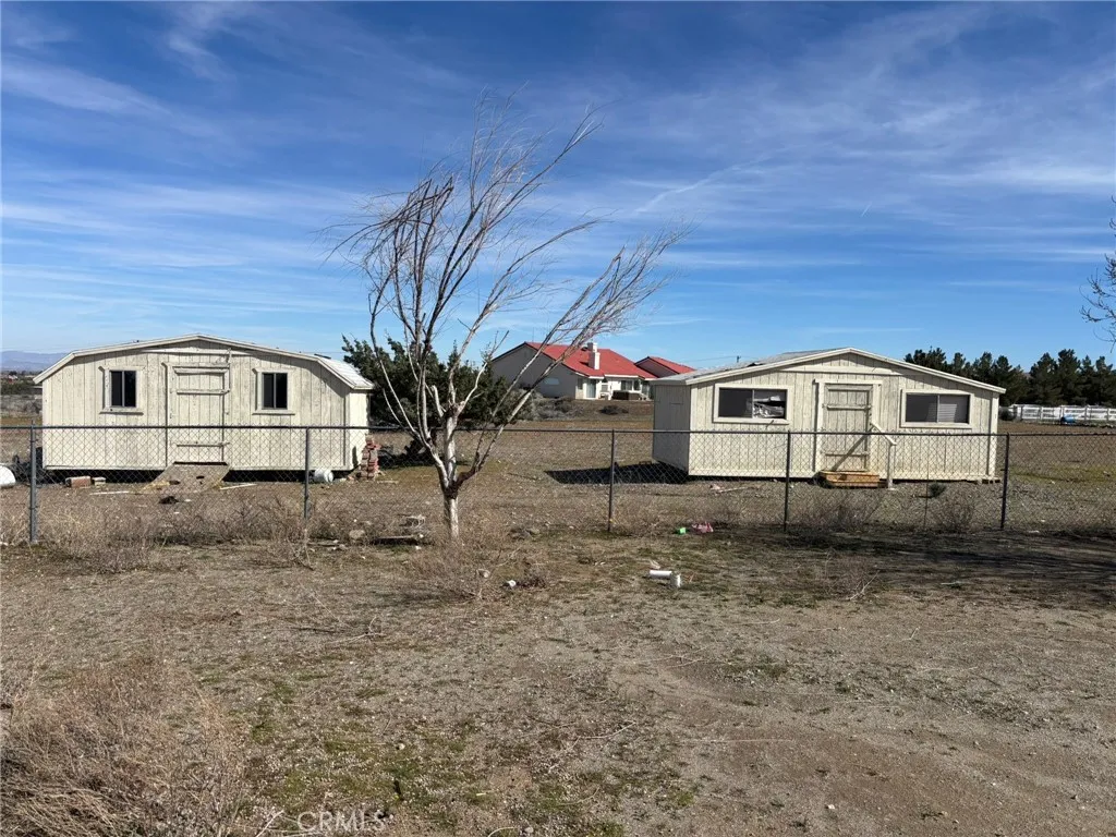 2 STORAGES IN BACK YARD