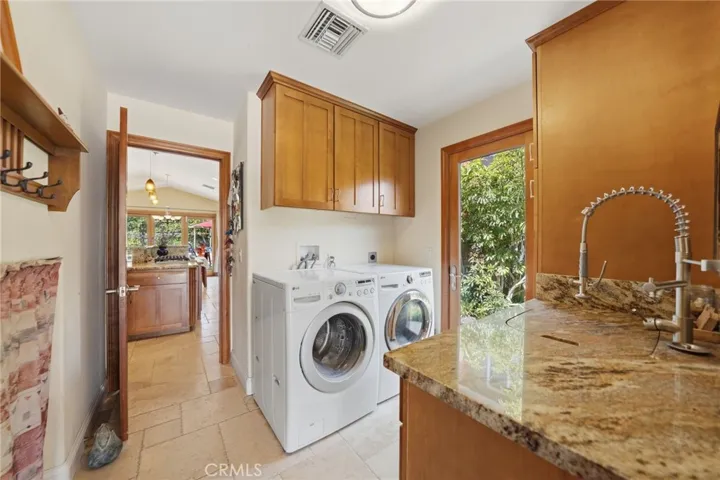 Laundry room with sink off the kitchen.