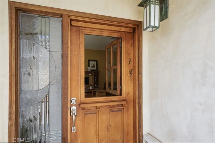 Custom Dutch door with stained glass side for extra light.