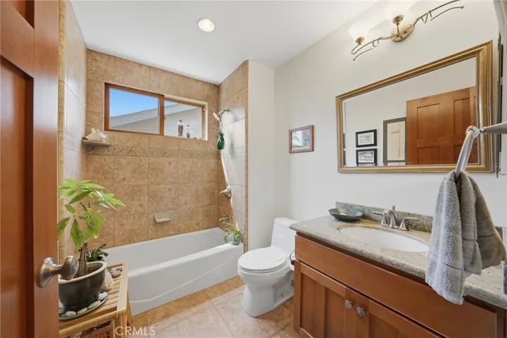 Guest bath located by office and main floor room.