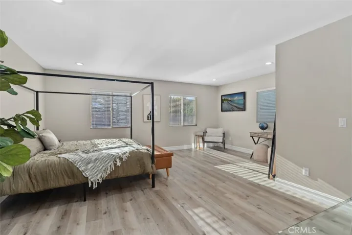 Primary suite with sitting area and walk-in closet.
