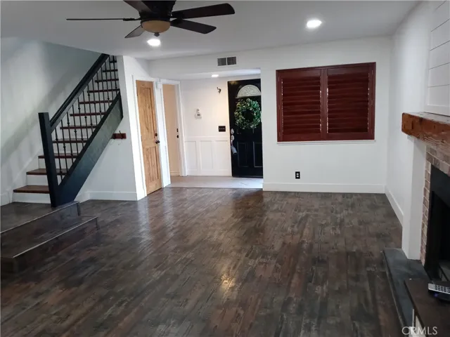 Living Room view toward Entry Door and Stairwell