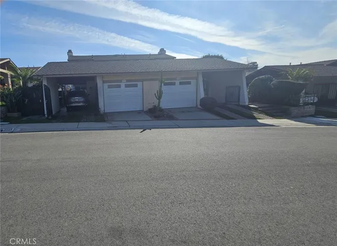 Front of Property - 1 Garage & 1 Carport