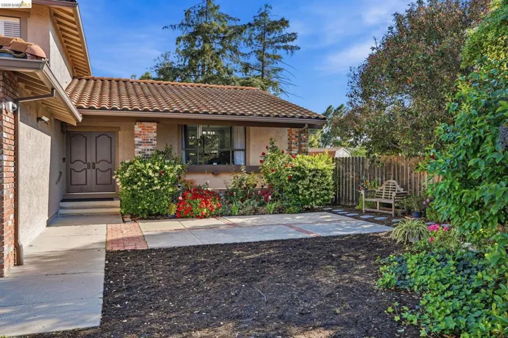 Doorway to property with stucco siding and a tile roof