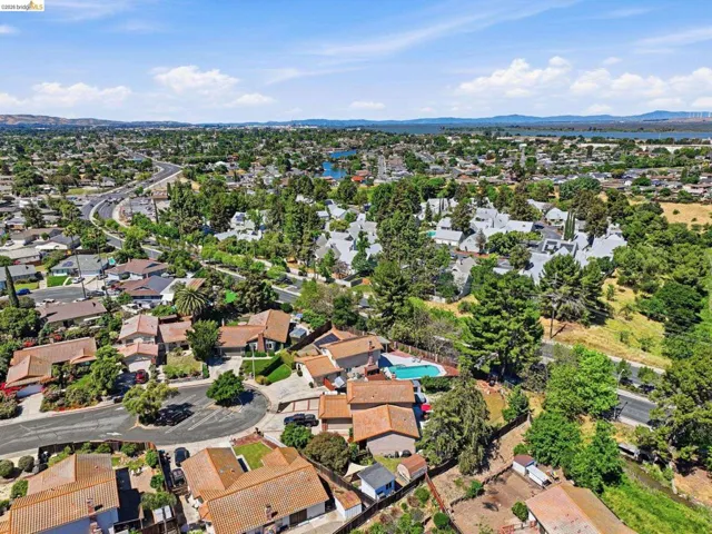 Aerial perspective of suburban area featuring a mountainous background
