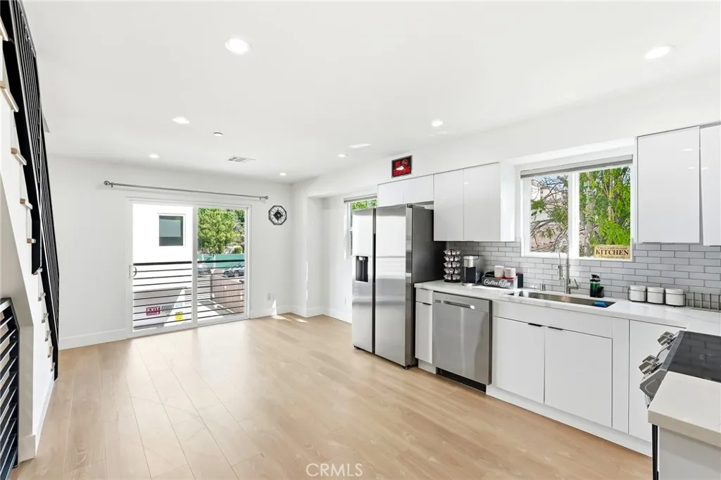 Living area with balcony & stainless steel appliances