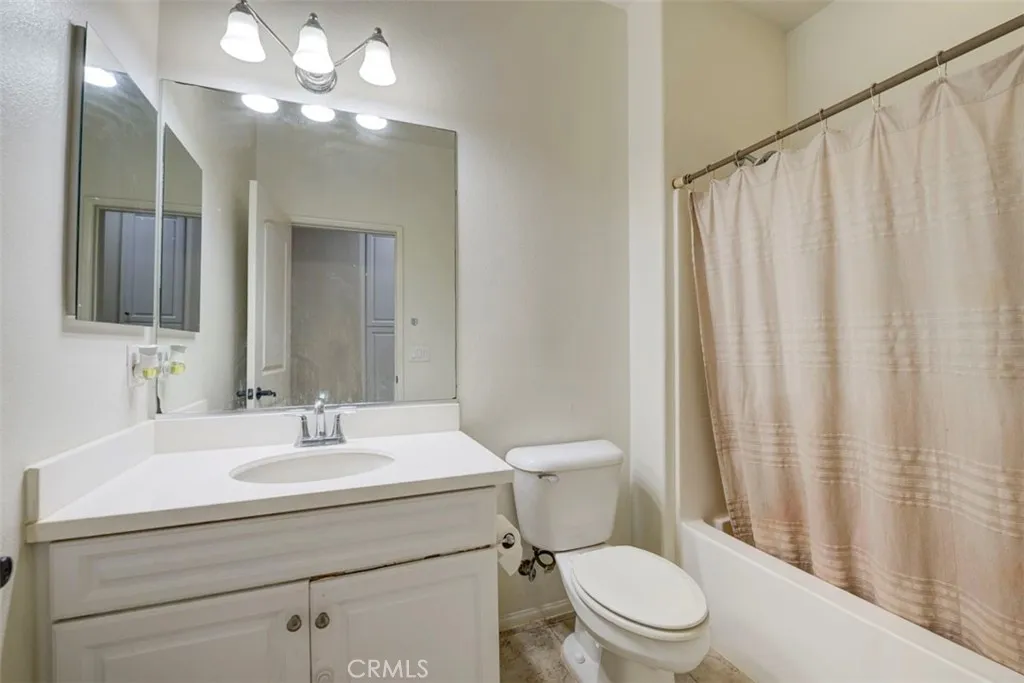 Hallway bathroom with tub