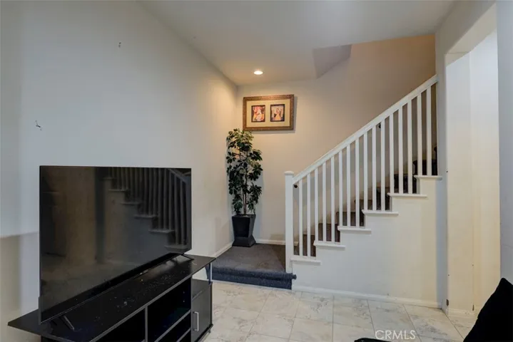 Downstairs foyer leads to laundry room and bedroom