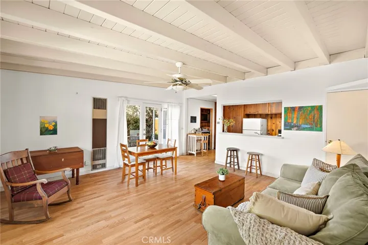 Open Living Room with wood beam ceilings