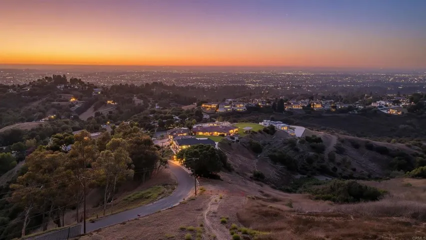 Breathtaking sunset views demonstrate the property's western exposure, with golden hour lighting.
