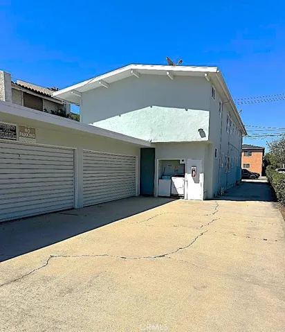 There is a Wide Open  Driveway Approach to the Garages.