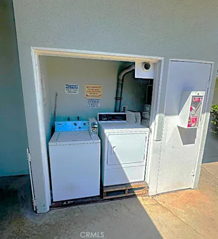 There is a Community Laundry Room With a Coin Operated, Seller Owned Washer and Dryer