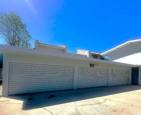 The Property Has Three Double Garages, Providing Enclosed Parking for the Six Units.