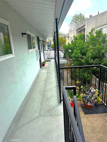 The Uppler Level Balcony Overlooks the Central Yard and Landscaping Trees.
