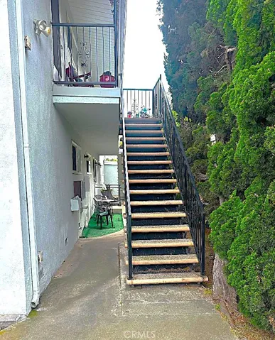 The Front Stairway Leading to the Upper Level Units Has Nice Adjacent Landscaping.