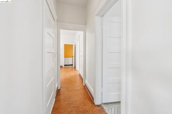 Corridor with concrete floors and baseboards