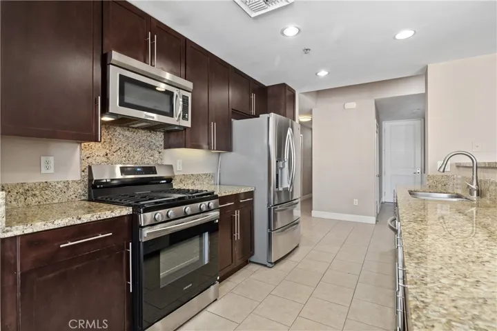 Open Kitchen with Stainless Steel Appliances