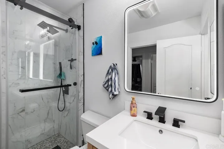 Full bathroom has an additional vanity (1/4 bath) in the primary
