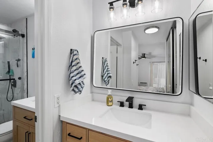 There's a second vanity outside of the bathroom in the primary suite.