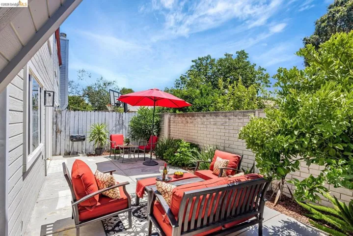 fenced backyard featuring a patio, an outdoor lounge area, and area for grilling