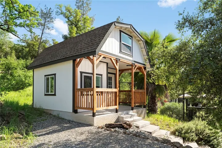 A detached, fully finished studio offers flexible space for an office, art studio, or guest overflow—complete with a loft, closet, and mini-split system.