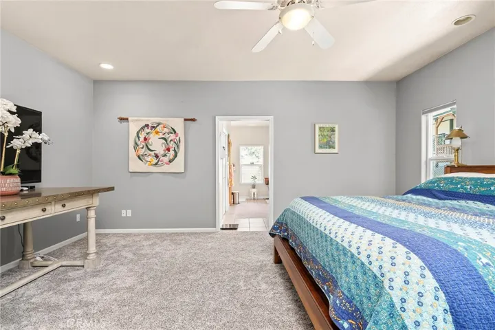 The primary suite is thoughtfully positioned on one side of the home w/oversized en suite bathroom with w/garden tub and separate shower.