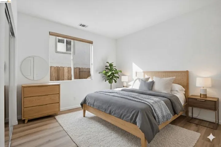 Bedroom with light wood-style floors