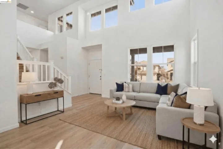 Living area featuring stairs and wood finished floors