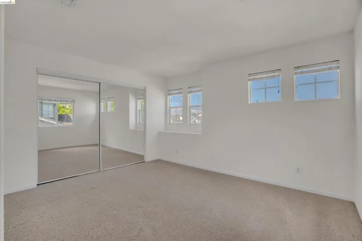 Unfurnished bedroom with a closet and carpet floors