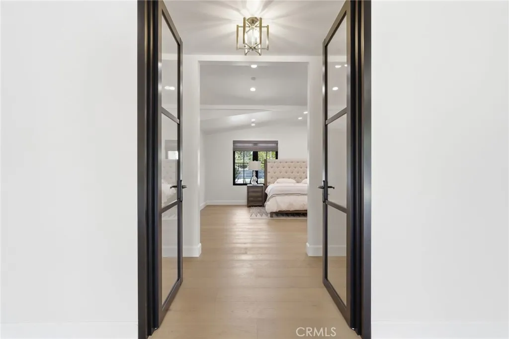Bedroom 4 dual glass door entryway