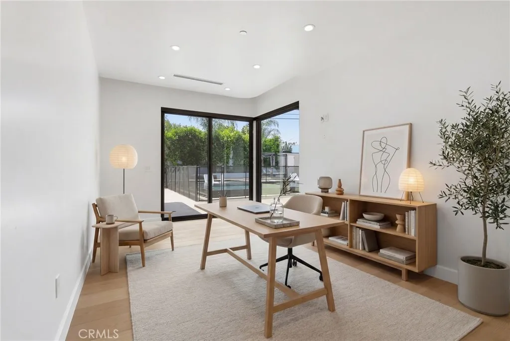 Bedroom 3 Jr. Suite with access to the backyard, 8 foot doors and window and private bathroom. (digitally staged)