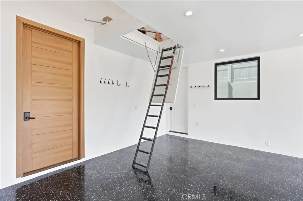 Pull down stairs to access attic storage.