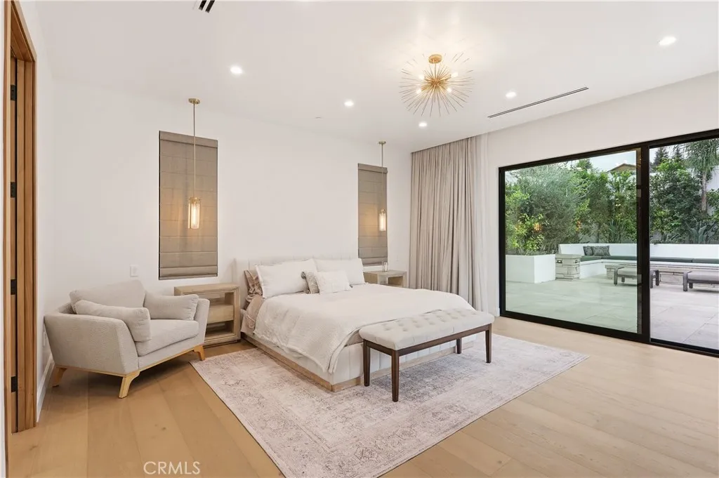 Master bedroom with 8' tall doors and picture window, automated sheer and black-out drapery and several lighting features!