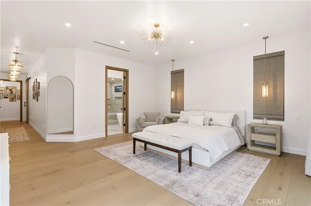Primary suite with plenty of space for a king sized bed, sitting area, dresser and more. Views of the backyard & pool!