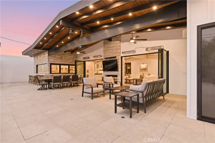 Covered Patio with dual zone recess lighting, 4 separately controlled heaters and plenty of covered outdoor space w/ high ceilings!